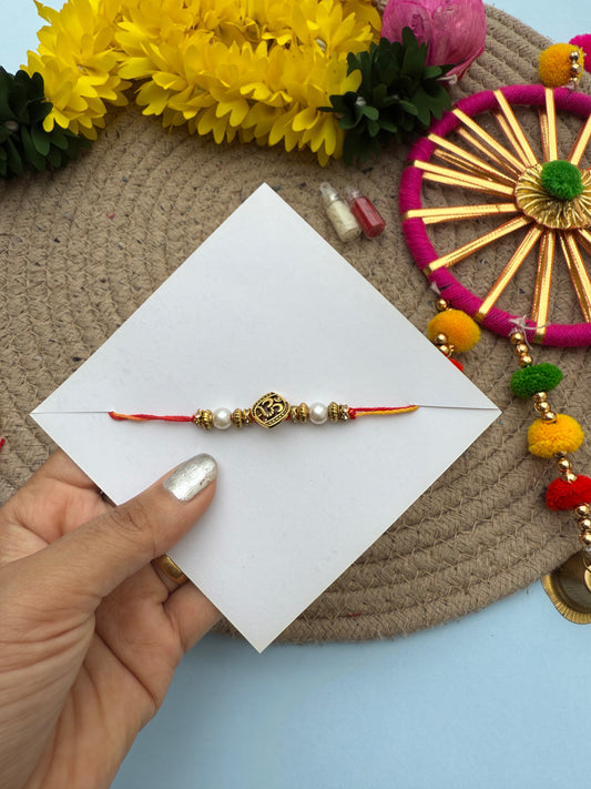 Minimal om rakhi by Elegantstyle