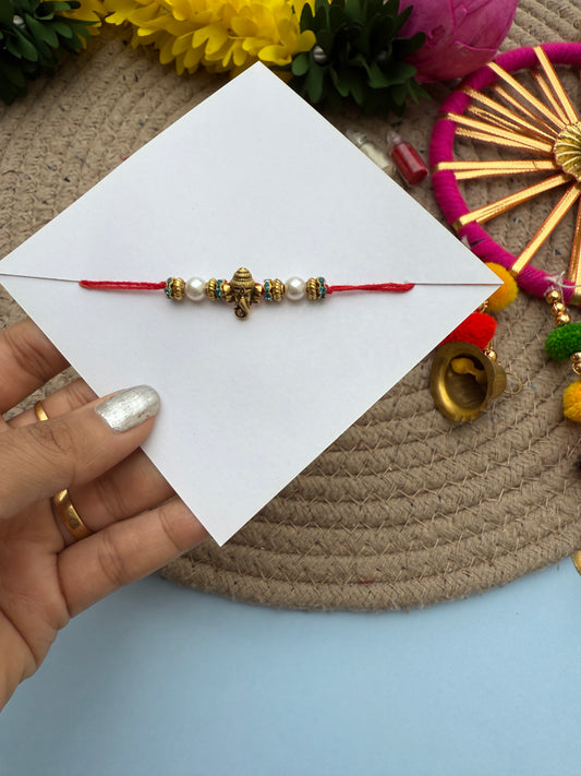 Minimal cute ganesha rakhi by Elegantstyle
