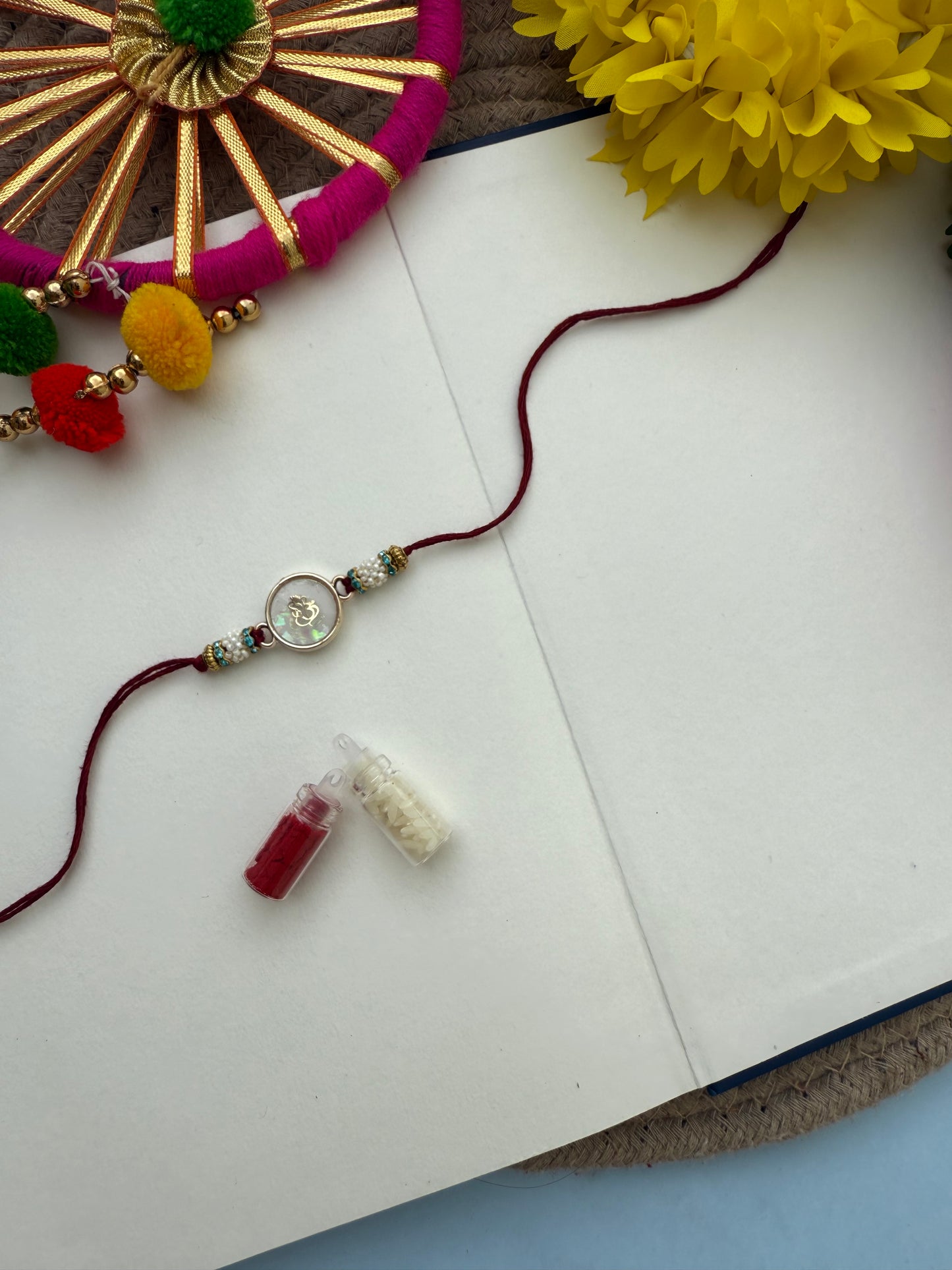 Resin Ganesha Rakhi by elegantstyle