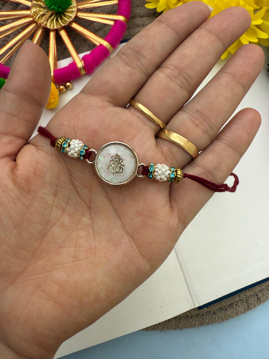 Resin Ganesha Rakhi by elegantstyle