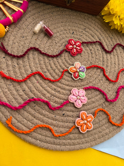 Flowers cowrie Rakhi by elegantstyle