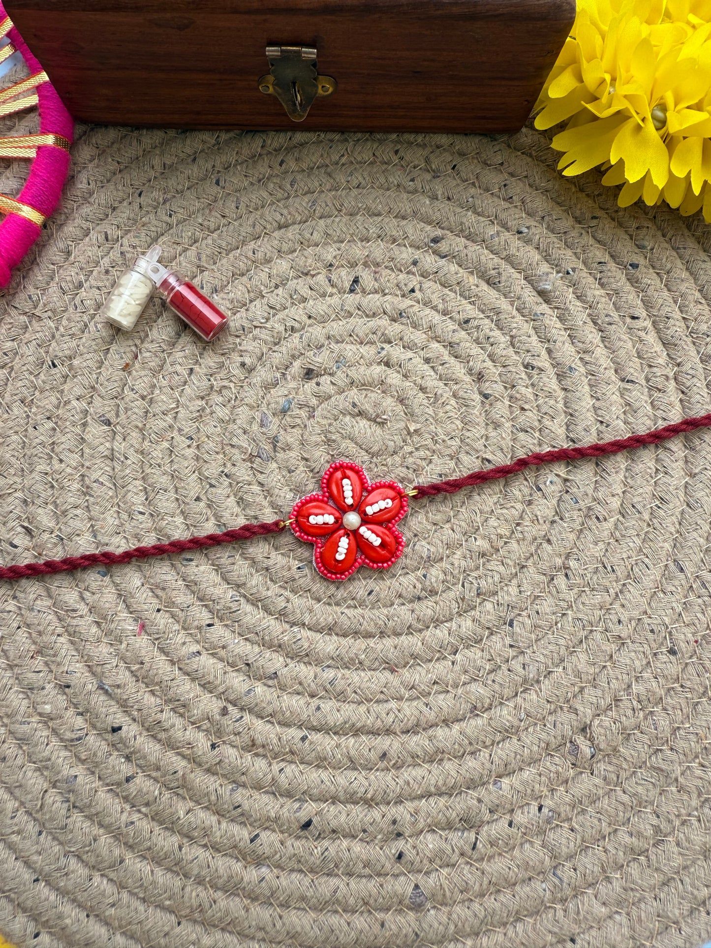 Flowers cowrie Rakhi by elegantstyle