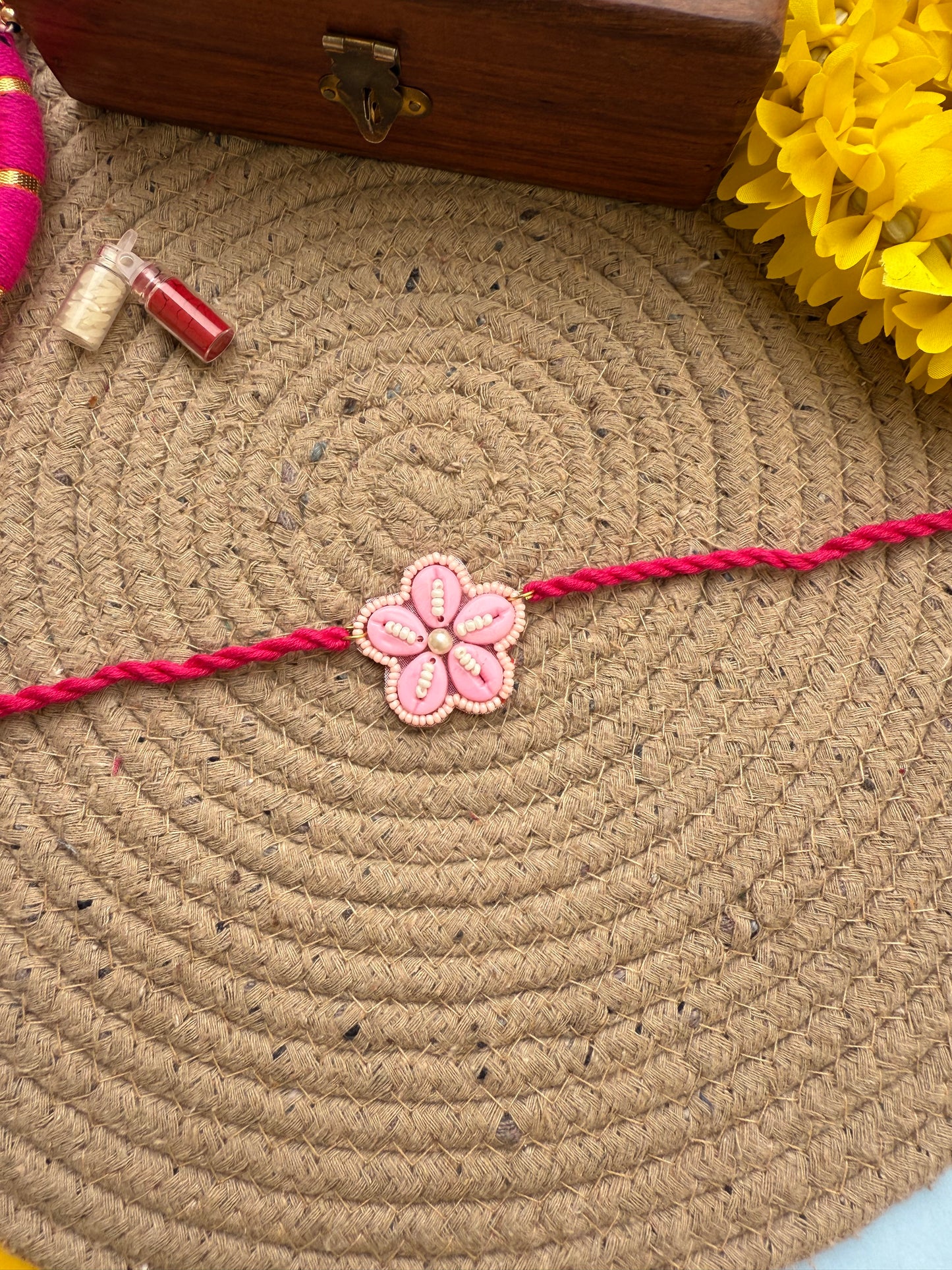 Flowers cowrie Rakhi by elegantstyle