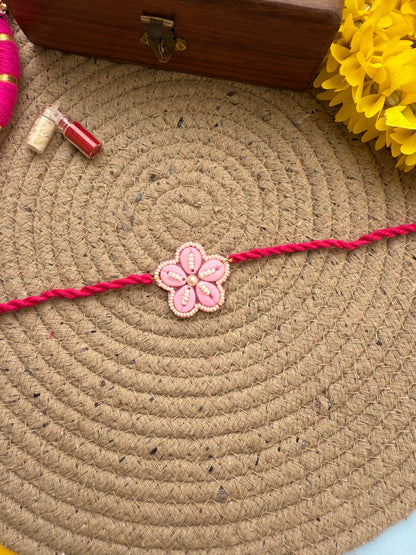 Flowers cowrie Rakhi by elegantstyle