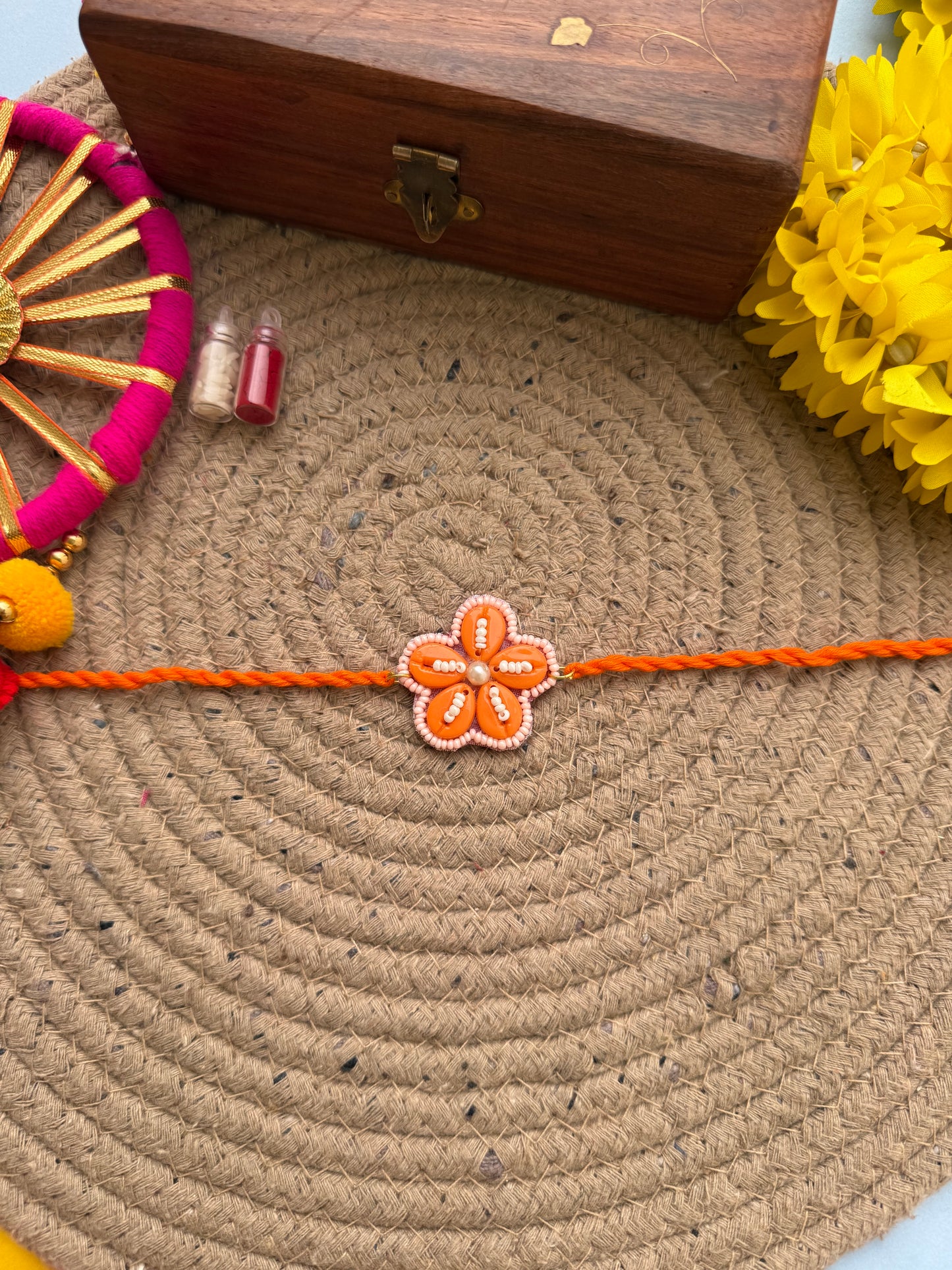 Flowers cowrie Rakhi by elegantstyle