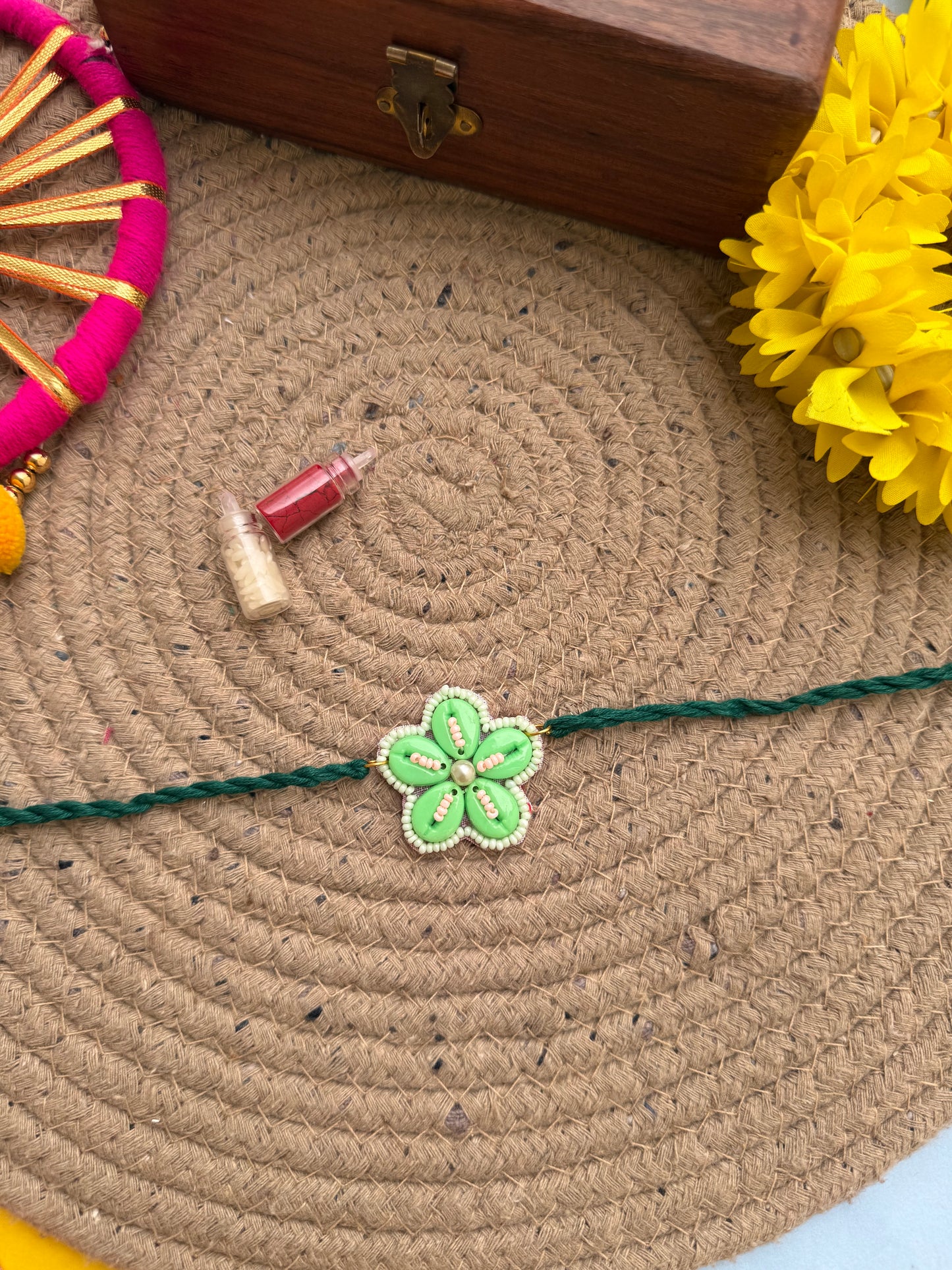 Flowers cowrie Rakhi by elegantstyle