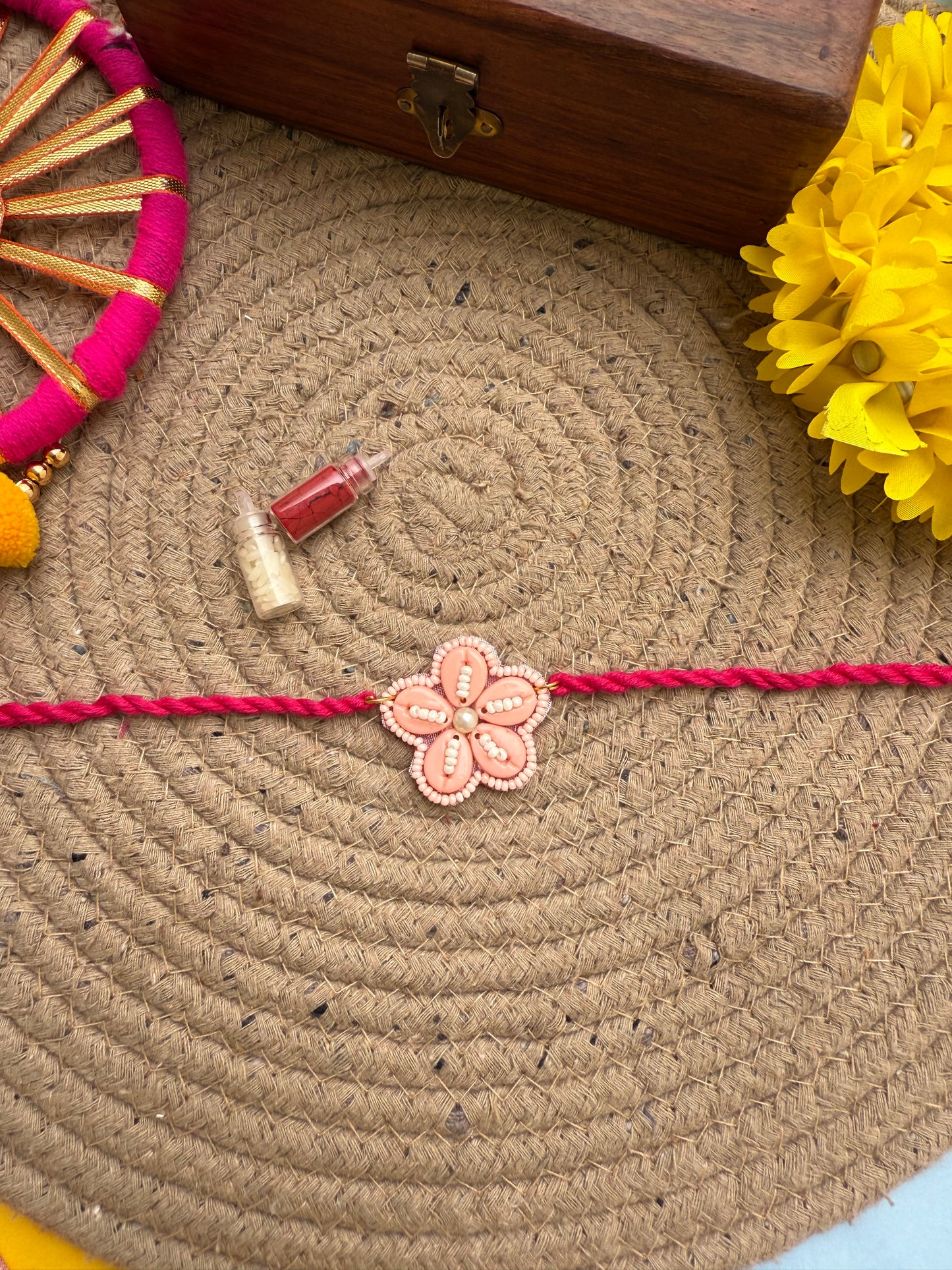 Flowers cowrie Rakhi by elegantstyle
