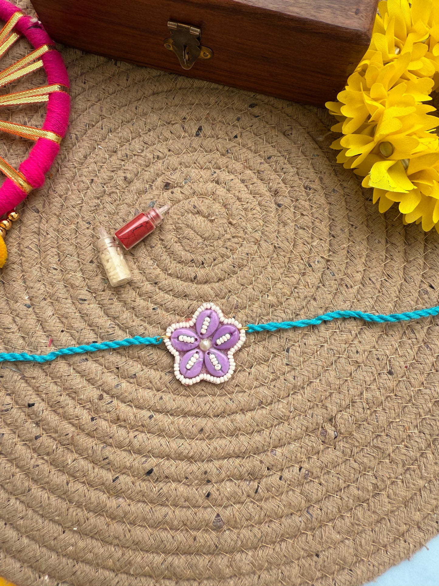 Flowers cowrie Rakhi by elegantstyle