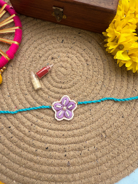 Flowers cowrie Rakhi by elegantstyle